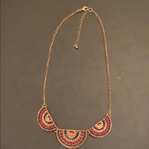 Gold-tone necklace with 3 charmed half-moons